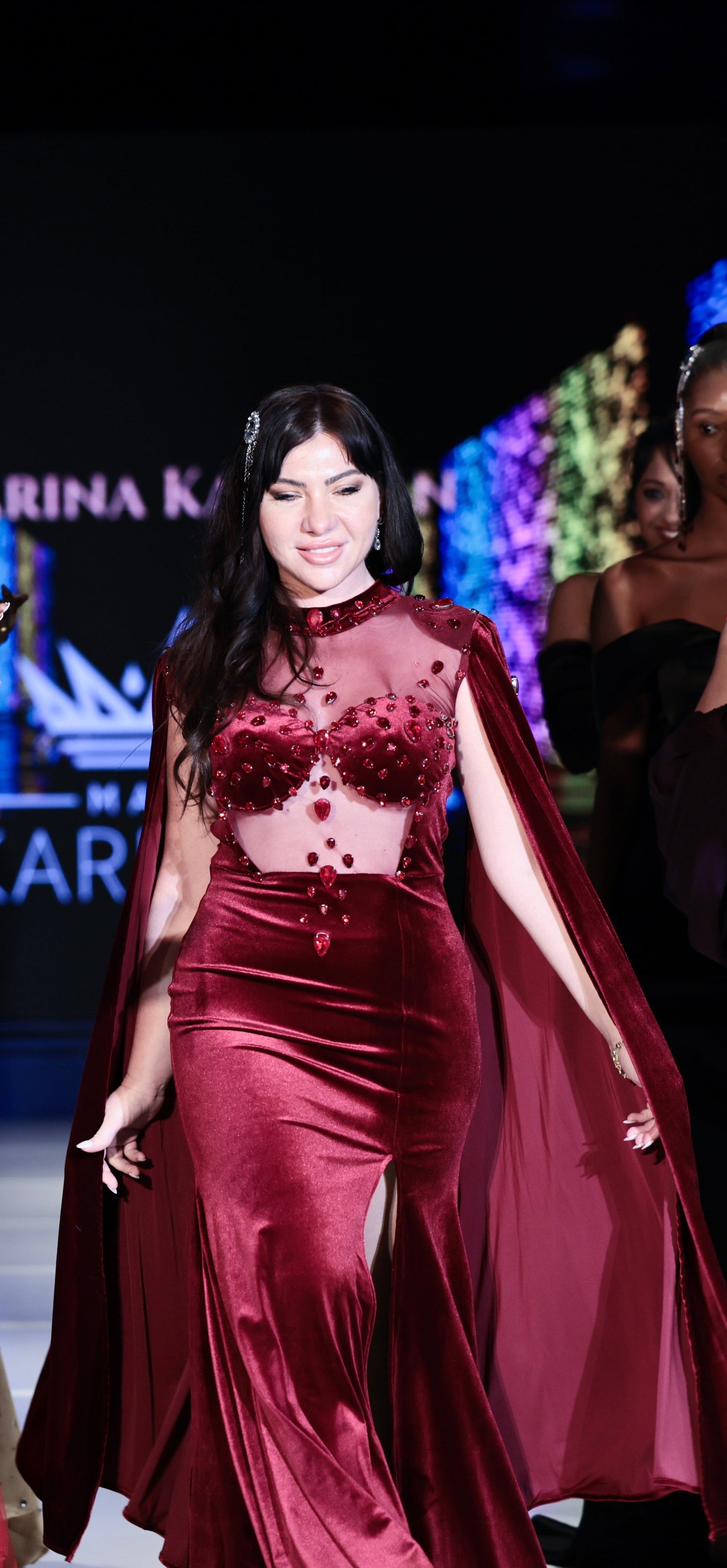 Luxury evening dresses by Marina Karelyan, designed to embody timeless elegance and modern glamour, featuring exquisite fabrics, hand-applied details, and graceful silhouettes that celebrate feminine sophistication.