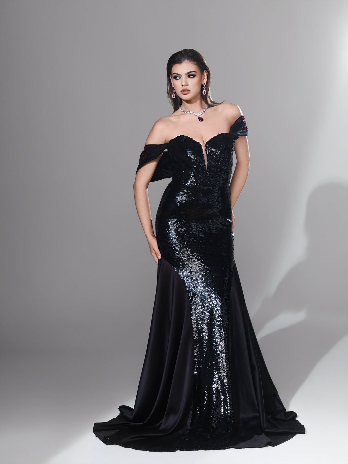 Natalya Black Sequin Mermaid Gown – Marina Karelyan Couture – front view, hands on hips, sequin bodice detail